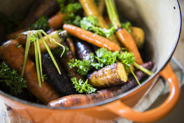 Roasted carrots and parsnips in a pot