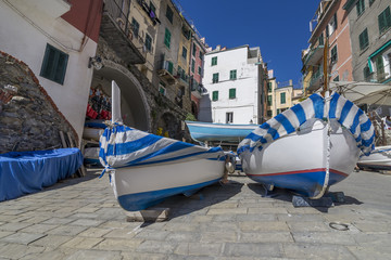 Fototapeta na wymiar The historic center of Riomaggiore with boats in dry under the houses, Cinque Terre, Liguria, Italy