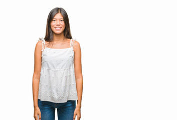 Obraz premium Young asian woman over isolated background with a happy and cool smile on face. Lucky person.