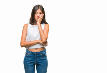 Fototapeta premium Young asian woman over isolated background thinking looking tired and bored with depression problems with crossed arms.