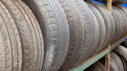 Obraz premium car tires in a row for sale at booth in store