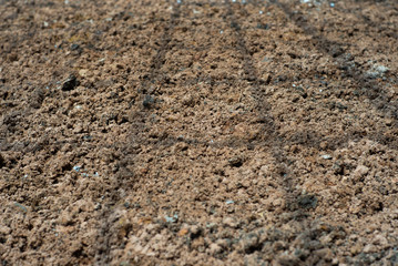 Abstract background and texture of .lateritic soil with the shadow of steel structure on the ground at construction site