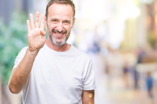 Middle age hoary senior man wearing white t-shirt over isolated background showing and pointing up with fingers number four while smiling confident and happy.