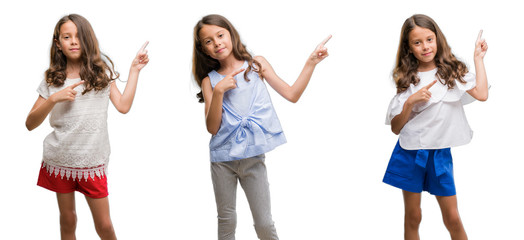 Fototapeta premium Collage of hispanic young child over isolated background smiling and looking at the camera pointing with two hands and fingers to the side.