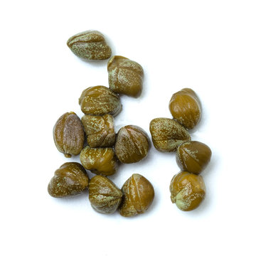 Caper on white background, macro