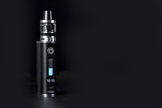 Electronic Cigarette  with an inscription on the display life, smoking kills concept, background image with space for text