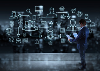 Businessman watching thin line social network icons interface