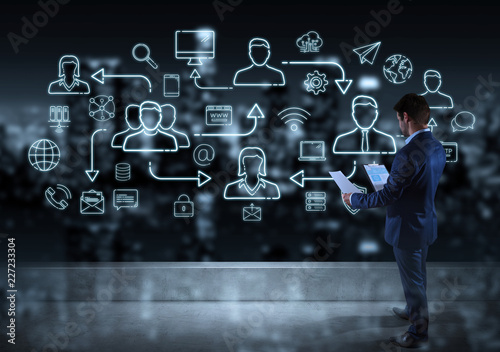 Businessman watching thin line social network icons interface