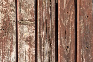 Vintage wooden background. Faded boards. Wall in retro style. The element of decor in interior design. Vertical boards. Wood texture