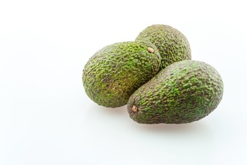 3 Avocados with copyspace text on white background.
Avocados are commercially valuable and are cultivated in tropical and Mediterranean climates throughout the world.