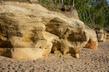 Veczemju Clifs Red Rocks, Latvia. Baltic Sea With Waves, Rocks and Blue Sky Sunny Day.