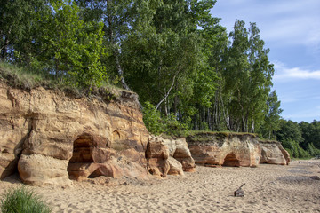 Veczemju Clifs Red Rocks, Latvia. Baltic Sea With Waves, Rocks and Blue Sky Sunny Day.