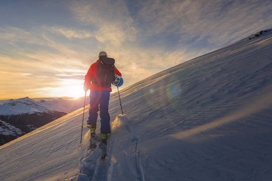 Skitouring with amazing view of swiss famous mountains in beautiful winter powder snow of Alps.