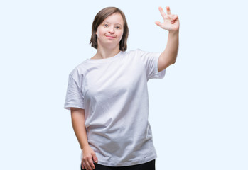 Fototapeta na wymiar Young adult woman with down syndrome over isolated background showing and pointing up with fingers number three while smiling confident and happy.