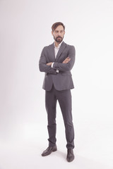 full height.a serious businessman in a business suit.isolated on white