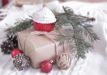 Naklejka na ściany i meble gift box and Christmas tree branch and decorations on white