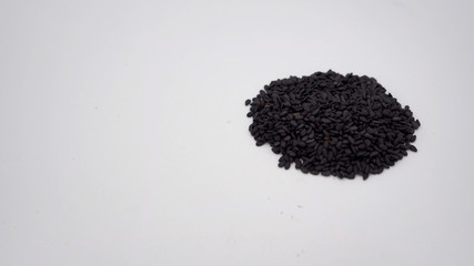 Black sesame seeds  are so nutritious on white background.