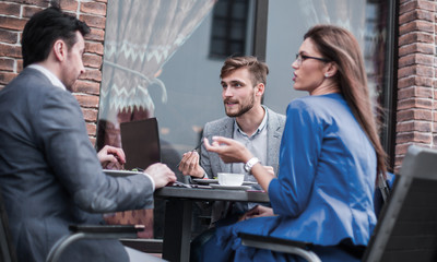 business colleagues discussing business issues at the coffee table
