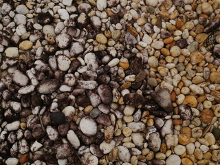 pebbles on the beach,texture of sand,stone concrete wall background