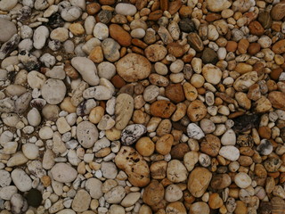 pebbles on the beach,stone concrete wall background
