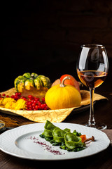 Green Ravioli with quail egg on a black background. A Halloween Feast.
