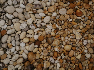 pebbles on the beach,texture of sand,stone  rock wall background