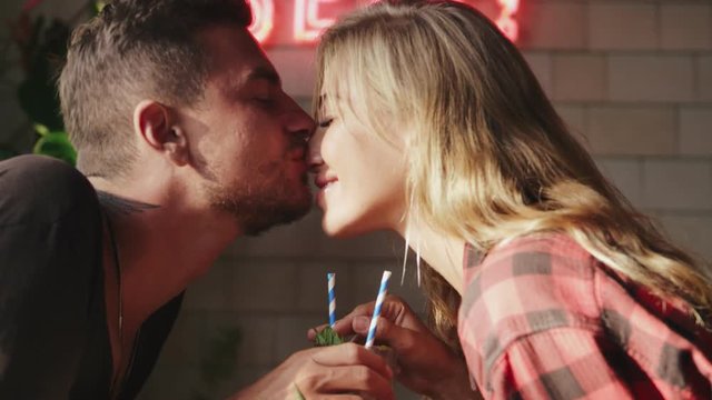 Young man and woman rubbing their noses