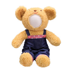 Teddy bears doll isolated on white background. Bear's doll in blue jeans uniform. Blank face toy for design.