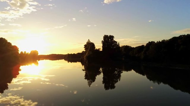 Sunset scenery lake reflection sunrise smooth water surface