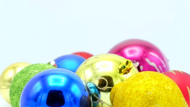 Christmas colorful balls close-up footage for loop on white.