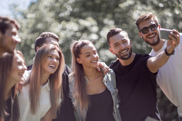 group of friends taking selfies in the Park