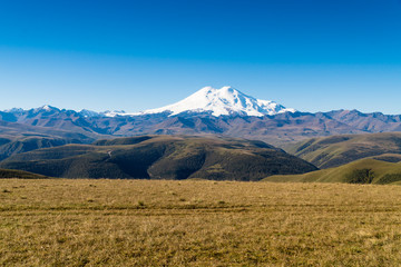 Fototapeta premium Beautifull landscape view of the mount Elbrus - the highest mountain in Europe. Caucasus mountains at autumn season time.