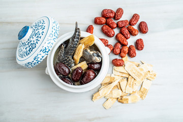 Chinese health soup - Huangqi red dates stewed black chicken