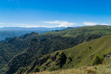 Fototapeta na wymiar Beautifull landscape view of Caucasus mountains near mount Elbrus - the highest mountain in Europe.