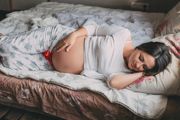 Beautiful pregnant woman, future mother, pregnant woman at home