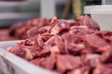 Protein and iron based diet. Gourmet chef, preparing a charity dinner in Italian. Steaks, chops, burgers and fillets for the homeless and poor on Christmas Eve. Empathy, social unbalance, global food 