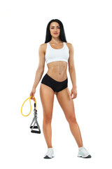 Fitness woman athlete and bodybuilder holding expander. Isolated on white background.