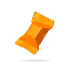 Candy packaging isolated on white background. Orange toffees product for your design. Clipping paths object.