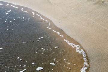 Sea wave on the sand
