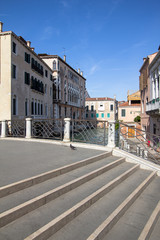 Fototapeta na wymiar Ponte delle Guglie on the small venetian canal, Venice
