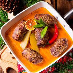 Wintry beef roulades with plum and bacon stuffing and cucumber