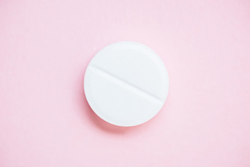 Fototapeta na wymiar top view of medical pill on pink surface