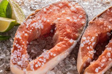 salmon steak raw in ice, closeup