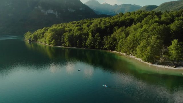 Top down aerial drone shot of a kayak paddling on a lake