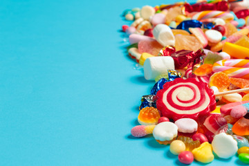 colored candies on blue background