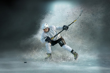 Fototapeta na wymiar Caucasian ice hockey Players in dynamic action in a professional