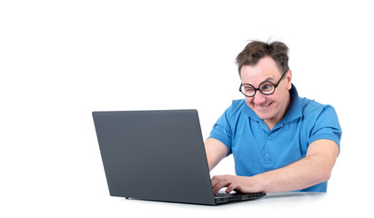 Man with glasses working on a laptop at the table, isolated on white background
