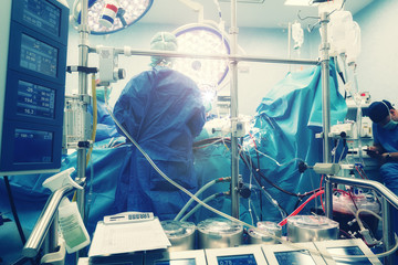 Cardiopulmonary bypass takes over the heart and lungs during surgery, maintaining the blood circulation, oxygen content of the body. The CPB pump heart–lung machine operated by perfusionists. - obrazy, fototapety, plakaty