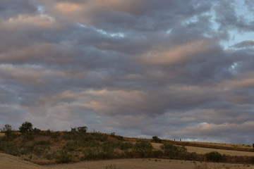 Stormy sunset in the fields