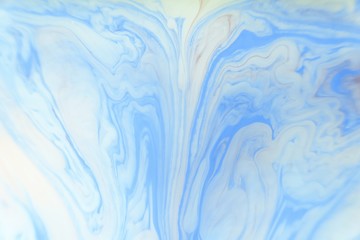 Obraz premium Abstract blue marble background. Stains of paint on the water.